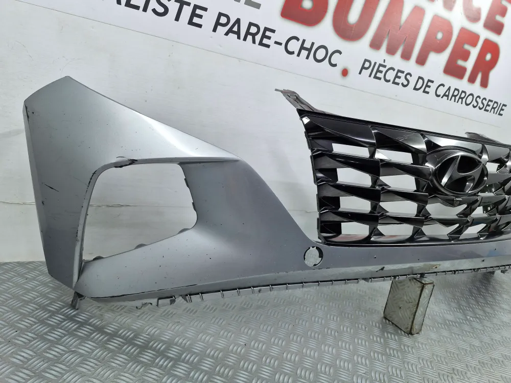 Etupuskuri Hyundai Tucson III Vaihe 1 (vuodesta 2021) – Alkuperäinen käytetty, kameran paikka