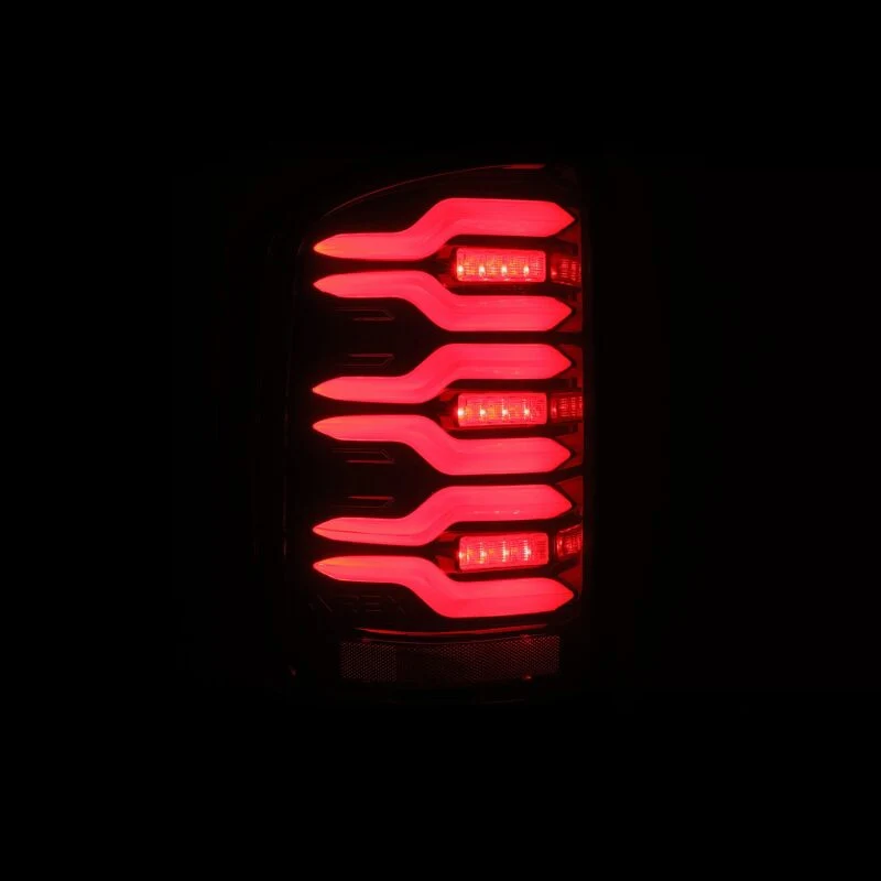 AlphaRex 14-18 GMC Sierra 1500/2500HD/3500HD LUXX-Series LED Tail Lights Blk/Red w/Actv Lgt Seq. Sig